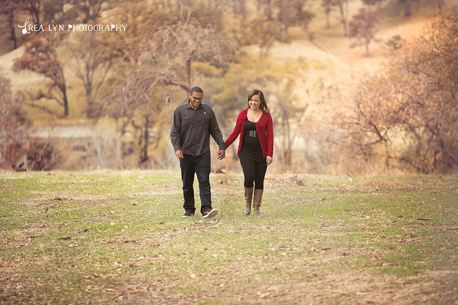 couple taking a walk in field brentwood portraits